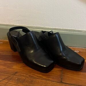 Intentionally blank black leather clog